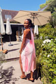 The fit is absolutely gorgeous! The pink colour perfectly fitted the colour theme of the wedding. The slit was too high, but I was able to attach a lace. Love it!!! Wearing for a dinner date next! - Louisa D.