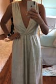 I usually order a size M in dresses but saw reviews saying this ran large so I ordered a small. The small was still way too big and the dress cut down much lower than pictured. I'm 5'8 and the dress is still very long as well. - Libby H.