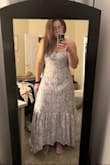 Absolutely adorable dress but it runs small and is very long - I'm about 5'5 and even with heels, the back of the dress drags on the floor so I will have to get it altered to wear it anywhere which is super sad. - Jennifer R.
