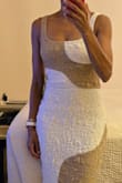 This dress is flatteringly form fitting, lined in the bodice, and as others have said, is a bit heavier than one might expect for a summer dress. You can wear a regular bra with it. Very pleased with the look and the dress. Plus, I got it on sale! - Lisa S.