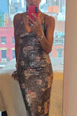 It's not my usual style, as I never wear sequins and, as others have said, the dress is brown, not charcoal. I also had to wrestle with the side zipper, but once I got it on, I loved it. (And so does the bf.) Haven't figured out where I'm wearing it yet, but the price was too great to pass up. Very pleased with my purchase. - Lisa S.