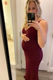I was able to wear this dress when I was 2-3 months pregnant, and it fit perfectly. I usually wear a size large in these dresses. It snatched right back to a perfect fit post pregnancy! - Sarah N.