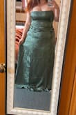 Loved the etherealness of this dress and the corset back and green color. Unfortunately, I had to return it because the middle section is long and sewn independently of the bust and hips, and it crashes right into my hips with no chance of flattening out. I ordered a XXL. Would have loved to wear it! - Cristina G.