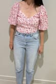 Such a cute top and very happy with it. I went up a size and is a little loose in the bust area but perfect around the waist. - Andrea L.