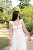 So I used this dress for my engagement photoshoot, and I loved it! I wanted something that would give me whimsical frolic vibes, and this did it 100%. It does run looser, BUT I am pretty positive it is supposed to be a little on the looser side, and if that is not something you prefer or look for, I don't think even sizing down would fix that style. - Regan I.