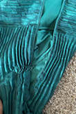 The dress was very cute and I was excited to wear it for a gala night! Unfortunately, the zipper broke when I tried it on. I normally wear a small and tried out medium because my bust is larger but the zipper still broke. Very disappointing - Olaoluwa O.