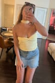 I ordered my usual size Small and it fits snug, even without a bra, but not so tight that I'd size up. The twist-front/bust section runs small and needs a little adjusting to get the cups to lay right, but overall, a super cute top for summer. - Mallory C.