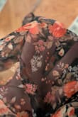 I was expecting a soft drapey dress, but the floral layer is like a stiffer, plastic-feeling tulle chiffon vibe. Just beware if you want something soft to the touch; this is not that. There's also no shape in the bust through to the waist; it just kind of drapes on you. It really feels like Lulu's quality is a fraction of what it was a decade ago, which might speak more to the fashion industry than anything. Where can people get something that doesn't feel like crap for under $100 anymore? - Lizzy O.
