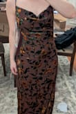 The florals on this dress are gorgeous, and I loved the soft feeling of the fabric. However, the straps felt cheap - very basic level spaghetti strap - and even sizing down to XS, this dress was not fitted through the waist/ lower back to accentuate my curves. If I were to keep it, I would probably want to alter it and add a couple of darts to keep it from hanging off of my body in a baggy way. - Lizzy O.