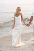 I bought this dress for my engagement photos and was pleasantly surprised. I'm not a fan of satin, but this dress was absolutely stunning and fit so beautifully!! I received so many compliments. It does wrinkle and is not a true white, but despite that, it was the most perfect dress! - Daria S.
