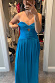 The medium felt like a large and the top part kept folding over. Very cute dress but definitely not functional. - Camila V.