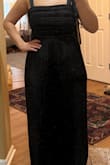 This dress arrived with a broken zipper. It was not flattering on my body. I am hourglass shaped and I think this would be better suited for a rectangle or apple shaped body. It just doesn't really highlight the waist so I have no visible shape in it. I did feel that it ran slightly large also, it's very loose and flowy. - Kathryn R.