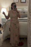 This dress was really cute and flattering! I went with a medium due to a larger chest, and it fit closer to a maxi dress than a midi since I'm short but would have been perfect with heels. Was able to be worn with a regular bra too! My only complaint was the stitching on the zipper was damaged and there were tons of threads pulling in various spots. Returning due to the damages but would have worn for sure! - Lauren K.