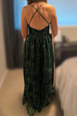 I have a pear-shaped body. My bust is 34C, waist is 31 inches, and a large fit me like a glove. I normally wear a medium top, 8/10 bottom. I'm 5'8", with a short torso and longer legs (33" inseam). The length was great, even with heels. The bottom is flowy, so it easily fit my wider hips at 41 inches, but it did make me look wide due to the puffy nature of the fabric. Ultimately, I chose a more form fitting dress over this one that made my body look more proportional. No complaints about quality. - Cassandra K.