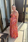 I think this was a beautiful dress for a summer wedding in Mexico! I loved the pattern. I have to preface this by saying I ordered this dress as I saw reviews that it was "bump friendly" given the material and fit. It fit beautifully with a non-padded sticky bra. I did have to take in the length by 2 inches or so at a tailor but otherwise fit perfectly and wasn't lined so it wasn't overly hot. I am 24 weeks pregnant here. For reference, I am 5'6 and probably weight 155-160 now but usually am about 125 so would normally likely get a small. - Christine N.