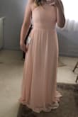 This dress is gorgeous! It's snug around the top area but it fits great! I'm short so it's a little long as well but not too bad! The color is perfect! Great dress! - Julie N.