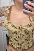 The tank top is beautiful, but I read a review saying it runs small, so I ordered a large, and it's huge on me. I should have ordered my actual size, medium. Now I'm stuck with it! - Annie G.