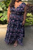 This dress is absolutely gorgeous!! The print is beautiful with rich colors, and the fabric feels high quality and looks expensive with all the details of the dress (center bust cutout, back tie). I loved wearing this and am so glad to have it in my closet - Anu J.