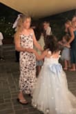Gorgeous and perfect for a semi-formal afternoon outdoor wedding. This was worn by my 11-year-old, so we pinned the top section. The style would be perfect for any age through 20. - Amy S.
