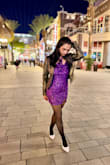 This dress exceeded my expectations! The rich purple color is absolutely stunning, and the sequin detailing catches the light beautifully without feeling over the top. It's the perfect balance of glamorous and classy.

The fit is true to size and hugs your curves in all the right places while still being comfortable enough to wear all evening. I paired it with black tights, white pointed-toe heels, and a metallic jacket for a night out, and I received compliments everywhere I went.

This is a fantastic choice for holiday parties, birthdays, date nights, New Year's Eve, or any event where you want to stand out. If you're looking for a fun, eye-catching dress that makes you feel confident, this one is definitely worth it! - Shobhana S.
