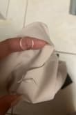Took it out of plastic packaging, and the button was already broken and fell off. Really disappointing. I know there's no exchange or returns on final sales, but the product could at least not be broken. My older pieces of Lulus are STILL in great condition after years of wash and wear, but the new stuff is cheaply made, inconsistent with sizing, etc. - Trish W.