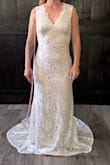 I purchased this dress thinking it was really pretty, but not thinking I would actually like it on me because of the nude liner. I fell in love! The nude liner matches my fair skin and also makes the lace pop. I will have to have the bottom hemmed, and the sleeves tightened a little, and cups added, but otherwise it hugs my body perfectly. It will be perfect for our courthouse wedding. If you're not sure about it, go for it and try it! - Cassie P.