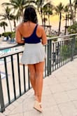 This skirt is very pretty and bounces a little as you walk. Be prepared to show a lot of leg, as it is short, but it's very cute, and my boyfriend absolutely loved it! The material is lightweight and has a slightly textured pattern. Great for a warm evening out. - Craig L.
