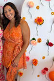 This dress is so pretty! The material and colors are exactly like the picture. I had to tie the halter and pin it in the chest area, as this part was really too big. The wrap waist section fit, but seemed disproportionate to the halter and chest. I made it work with my adjustments!! - Chelsea O.