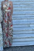 This dress is very flattering and comfortable. The material is flowy with vibrant and beautiful colors. It is a bit long. - Brittany K.
