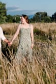 The dress is a perfect midi length for anyone 5'5 to 5'7. It ended at the middle of my shin. The slit is such a cute touch. You'll definitely need a strapless bra or to go bra-less with this dress! I love this dress, and it could be worn to so many types of events. - Kayla C.