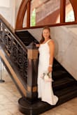 I loved this dress. I was somewhere between a small and a medium. I opted for the small because the fit was more flattering, being tighter than baggy. I had to have the length brought up. The bow in the back was my favorite part. I highly recommend this dress to all future brides. - Nicole G.