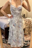 Fits perfectly in every way! My first time ordering from Lulus and everything I bought was incredible! The straps are adjustable and tie in the back, which is a plus for me. I ordered a small & it fit like a glove; length was great, too!- A larger bust (which I envy!!) might not have luck fitting in the top though! - Abigail Y.