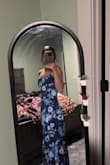 A stunning dress, floor length, with a fit and flare. Straps are not adjustable but with proper sizing it should not be an issue. Zipper runs on the side with a modest slit for air flow if you have an event during a warm season, the back is my favorite! Crisscross with a peekaboo opening! Absolutely stunning. - Hannah D.