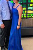 It hid everything I was trying to hide; it was super fun on the dance floor. The color was stunning. I did hem the sleeves due to being in the itty bitty department for my upper half. 5'5 170lbs - Amy M.