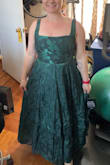 This dress is perfect for the formal wedding I'll be attending in the fall. The corset back gives a little wiggle room, since the fabric has no stretch. If you're a shorty like me, this dress will fit like a maxi dress (which is what I wanted, since most maxi dresses are too long). I'm 5'1 in an XL, and it hits at my ankles. With Lulus dresses, I fluctuate between a L or XL depending on the stretch and style of the fabric. Definitely size up if you're in between sizes like me. I do have to shorten the straps, which are not adjustable, but that's an easy fix. I love the dark green jacquard fabric- it looks and feels expensive. I can't wait to wear this to my upcoming event! - Allie L.