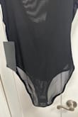 This bodysuit is really beautiful. The style is different from what I have seen, and I know it will go great with lots of bottoms. The only reason I gave 4 stars is the bottoms are full (not a thong), and this is not mentioned in the description. I probably would not have purchased it if it was mentioned. - Nancy S.