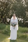 Loved this as my wedding dress, fit perfectly. Was slightly heavy with all the beading. I found every single time I tried it on, even though I was super gentle, about 15 or more of the white sequins would just fall off the dress. They don't seem to be attached very securely. - Grace N.