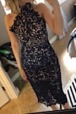 It's hard for me to find a dress that fits without alterations because I am so short. This dress was the perfect length and size. It was a bit tight but I wouldn't go for a bigger size. I wore it to a wedding and received so many compliments, it's a beautiful dress. Highly recommend it. - Marina G.