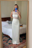 I ordered several options from Lulus for my city hall wedding and liked this one the most! Honestly surprised how much I love it! The pleated part at the top of the skirt does hang a bit loose and awkwardly, but should be a pretty easy alteration. Not sure if I'll end up keeping this, but it's definitely a top contender for my wedding!! I ordered my normal size xs and would say it fits tts other than the pleated part. - Lindsay C.