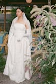 This was my wedding dress, and I loved it so much! I did have it tailored- took some length off the bottom and added a liner since the bust area had the seam showing through. Otherwise, very comfortable and super affordable. We had a summer wedding in the middle of our city last August, so I was going for a classic/vintage look. Would recommend! - Samantha B.