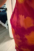I'm very disappointed with the quality of this dress, especially considering it costs $75. The fit and construction are very poor. We first ordered a size small, but it was extremely large, so we exchanged it for an XS. The XS fits better through the body, but it is uncomfortably tight around the neck. The sides are poorly made and do not lay properly, as you can clearly see in the photos. For a $75 dress, I expected much better quality, construction, and fit. Unfortunately, this was very disappointing. - Maria M.