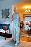I'm a mother of a groom buying for an on the beach wedding. Fabric of this would keep me cool. I did not love the fit, but the BIG mistake in this gown is back zip and it only goes halfway up the back. There is NO WAY to get into or out of this dress without help! That made me decide no. - Carrie E.