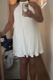 I had high hopes for this dress! mostly loved the fit of it, and it is pretty stretchy in the bust as well, so I was able to order a M (I'm usually a L).
However, I'm returning it because the ruffling at the bottom ended up not looking like the picture on the site. Online, the bottom of the dress looks more like a bellflower, but irl it ended up looking like bunched up toilet paper :( - Gilanne D.