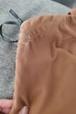 The dress fit really well and is pretty. I got lots of compliments, but I noticed it was fraying- not sure if that's the right word- I noticed it the day I wore it for a wedding around the chest area, and I just thought, oh well, it's not that noticeable. Then I came home and washed it, and it's fraying around the underarm even more, and the top chest area looks worse. Not really sure what I can do to fix it, but I don't think I'll get a second wear out of it, which is super disappointing. Can't return it cause I wore it. - Angelica R.