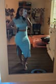 The fabric is stretchy, and it fits PERFECTLY. I love it so much I might buy the other color. - Melanie G.