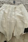The pants in the photos are shown with well-lined horizontal lines. In reality, the lines are all over the place. The material is nice though. - Elena W.
