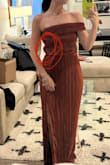 The seams were all uneven and stretched out and would pucker out on the sides. Even when standing up straight, the zipper seam didn't hold up. The part that goes around the arm was weird and the fabric didn't flow in nicely with the dress. Overall, poorly made - Madie B.