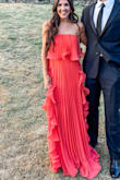 I absolutely loved this dress very flattering and flowed beautifully. Fit great on the top portion, but definitely for taller girls. I am 5'4 and wore 3 1/2 inch heels, and the dress was still dragging about 3 inches on the ground, so I spent most of the night holding it up. Other than the length, everything else about the dress is beautiful. - Kaley G.