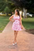 This charming pink and white floral dress is the epitome of summer elegance. The A-line cut is universally flattering, while the vibrant print makes a cheerful style statement. - Shilpi T.