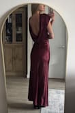 I love the dress; it fits amazingly and is very elegant. The only problem I have is that it came with a stain on the neckline that I didn't catch before I cut off the tag that ensures I would be able to return it. Hoping I will be able to get it out, but a little disappointing that I received it looking already worn. - Emily D.